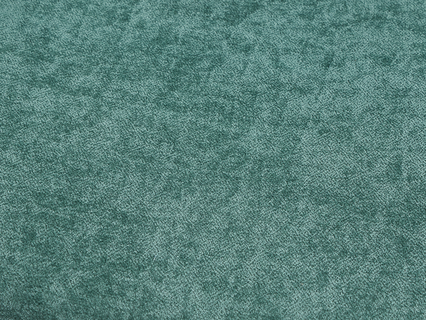 Closeup of soft teal velvet fabric ideal for upholstery projects