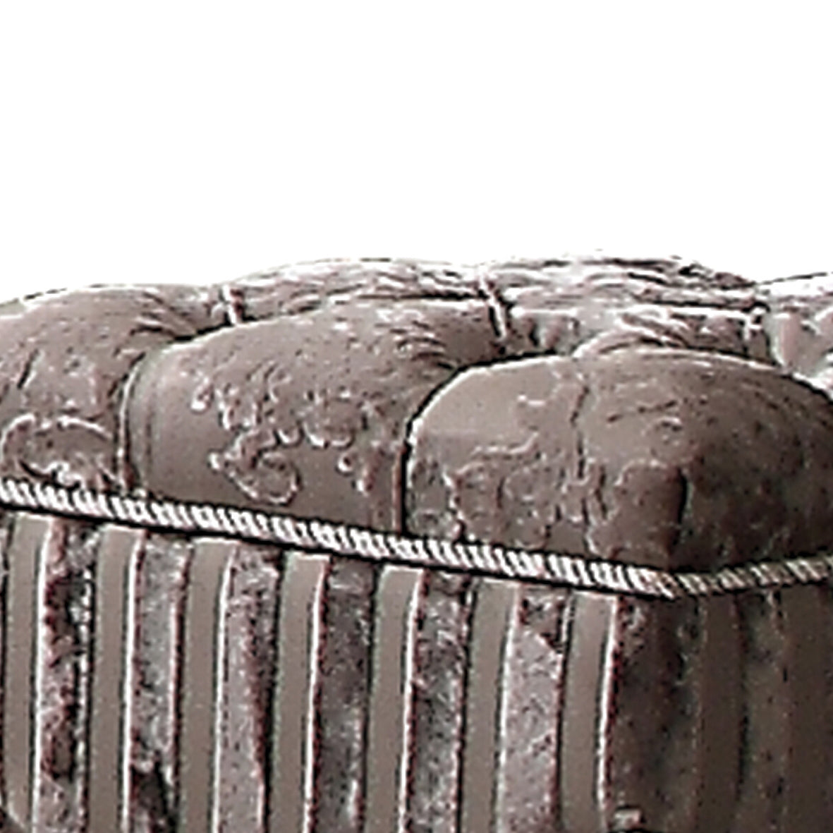 Tufted grey fabric ottoman with detailed floral pattern and striped base