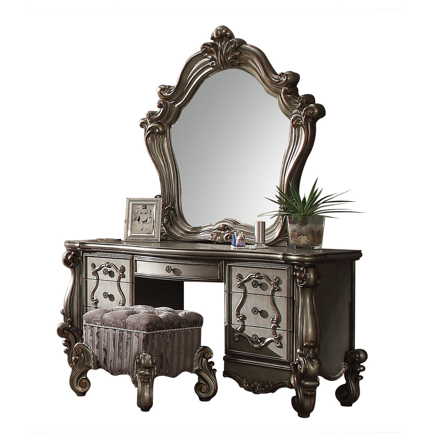 Ornate silver vanity with large mirror and upholstered stool ideal for bedroom decor
