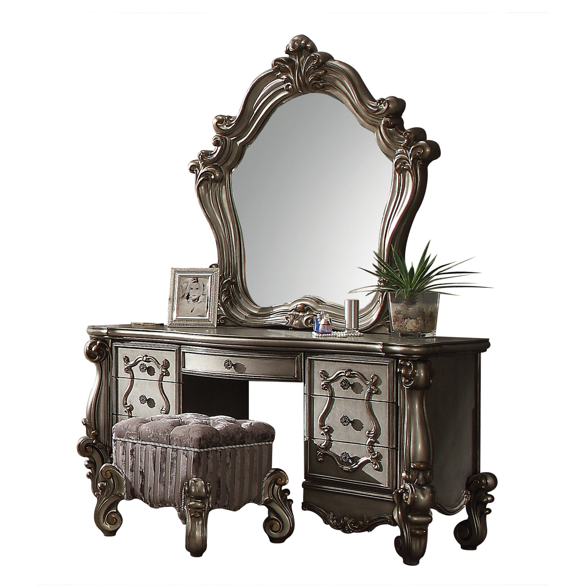 Ornate silver vanity with large mirror and upholstered stool ideal for bedroom decor