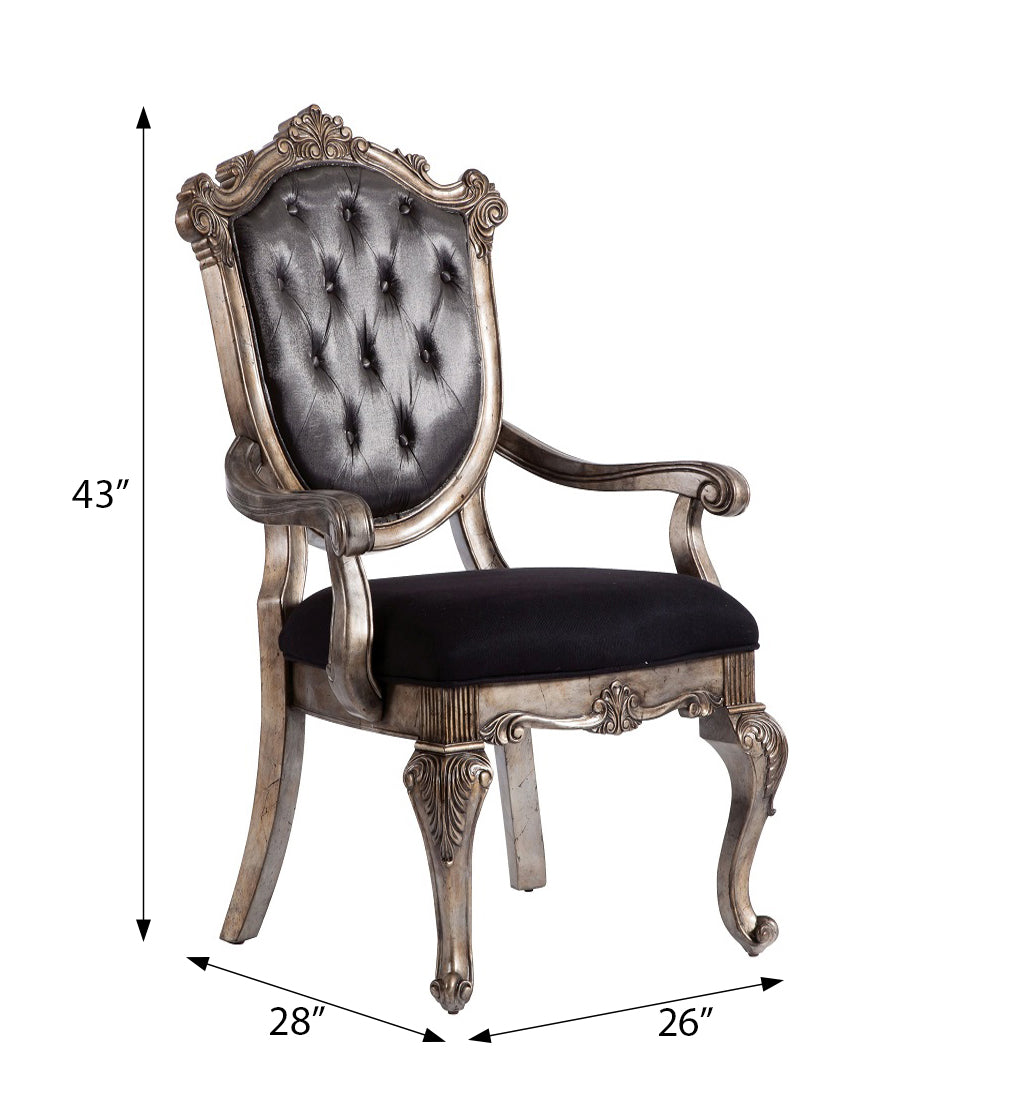 Ornate silver armchair with tufted black upholstery elegant antique style