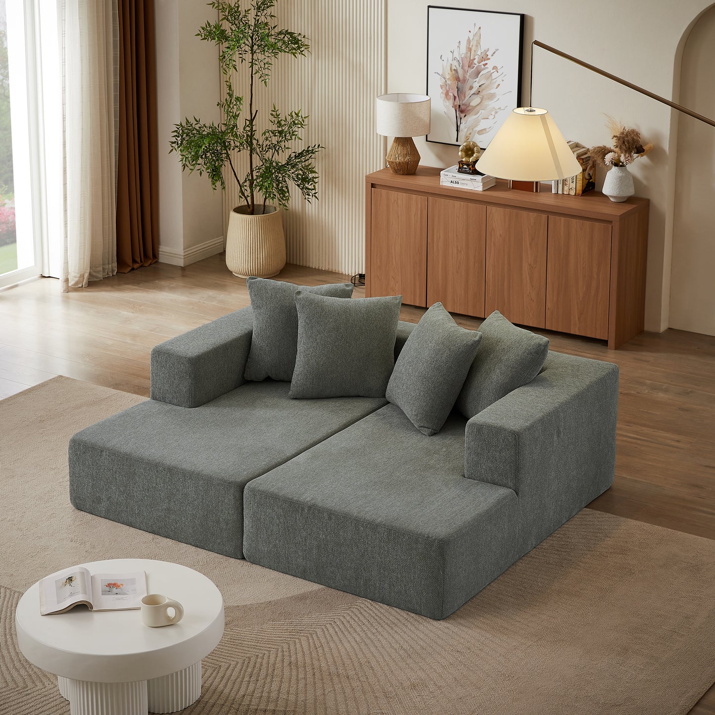 Gray modular sectional sofa with plush square accent pillows modern living room