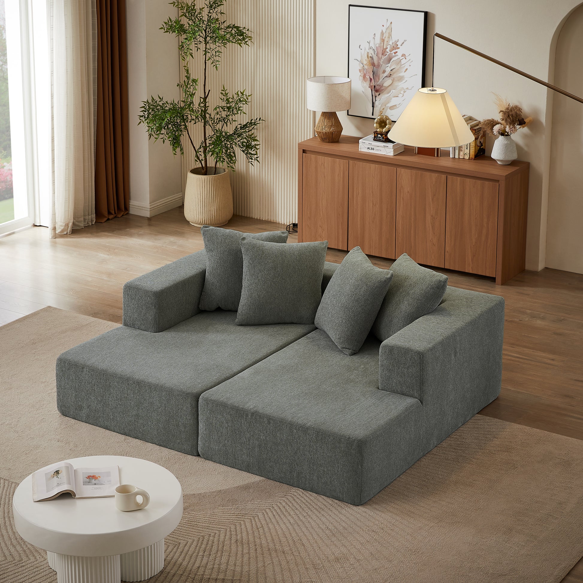 Gray modular sectional sofa with plush square accent pillows modern living room
