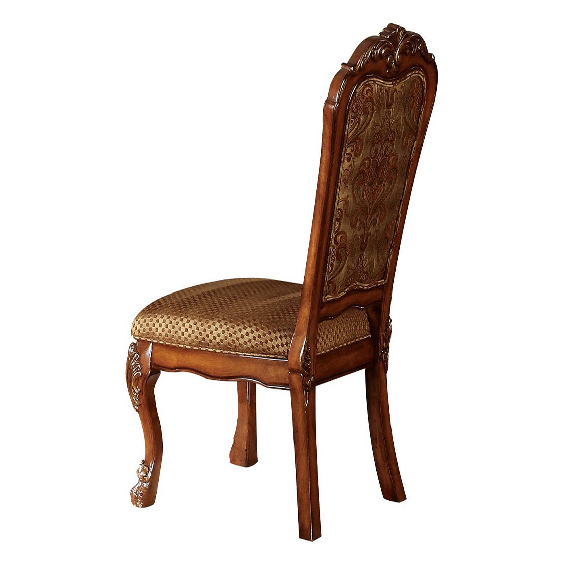 Ornate wooden dining chair with patterned brown upholstery and carved detailing