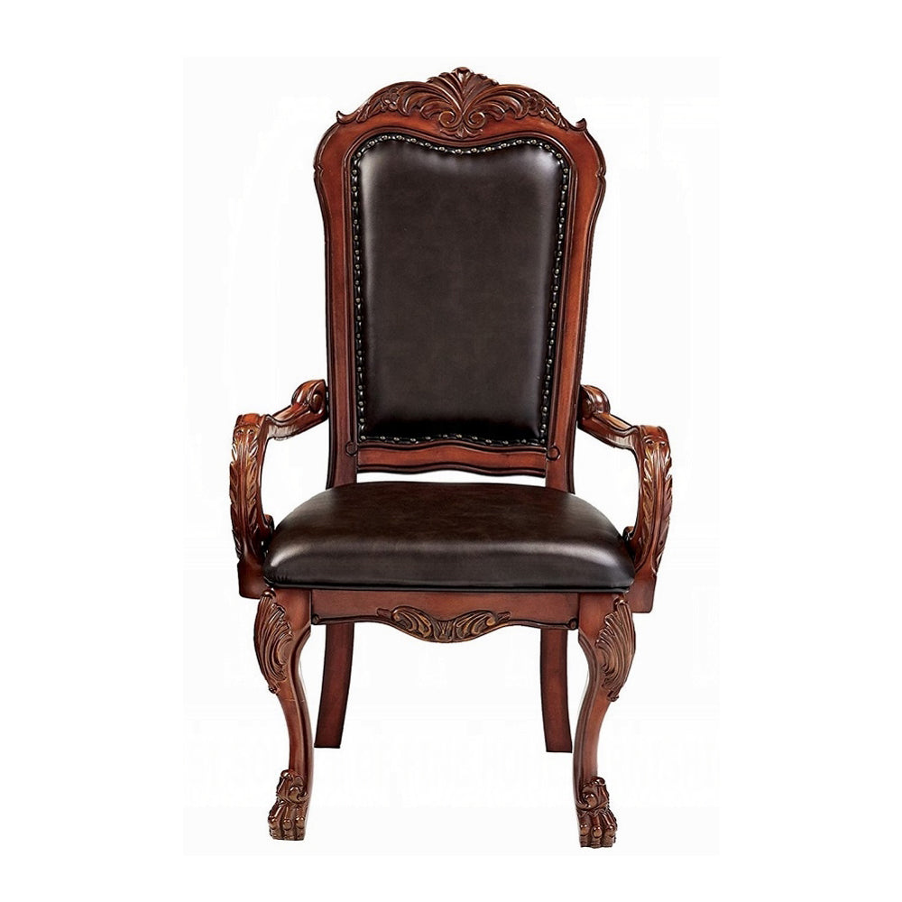 Ornate dark brown leather upholstered dining chair with carved wooden frame