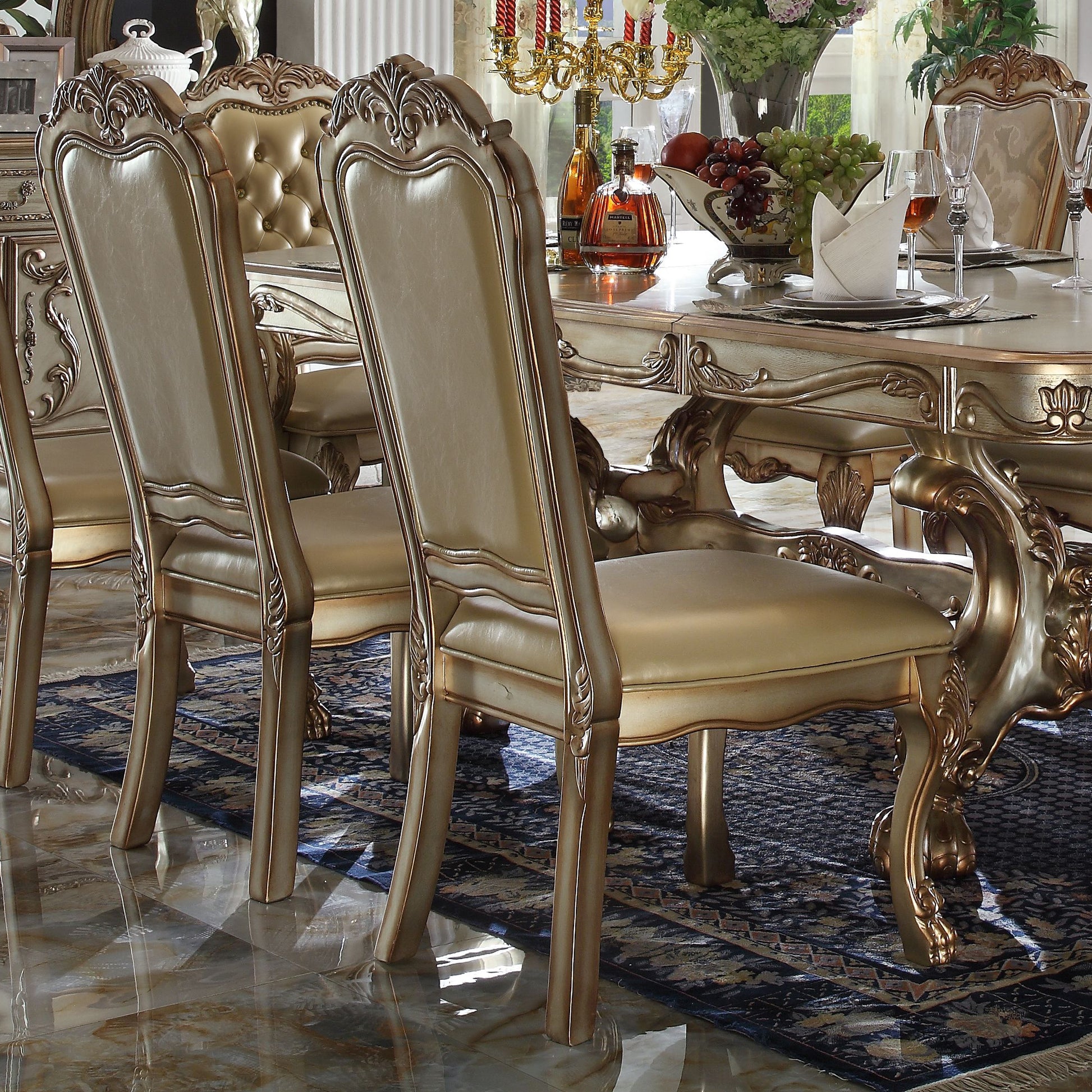 Luxury ornate dining chair with tufted cream leather and gold trim