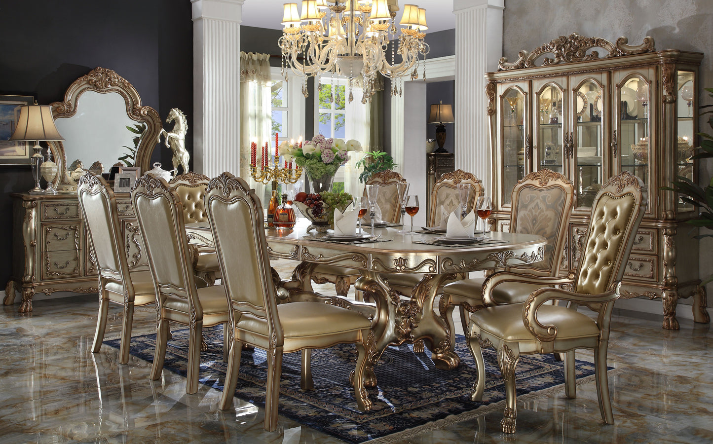 Opulent antique gold dining table with ornate carved details and tufted champagne upholstered chairs