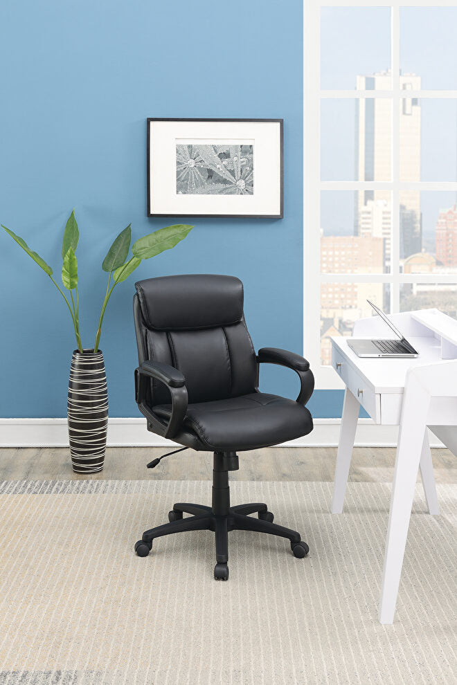 Black executive office chair with lumbar support and padded arms on wheels