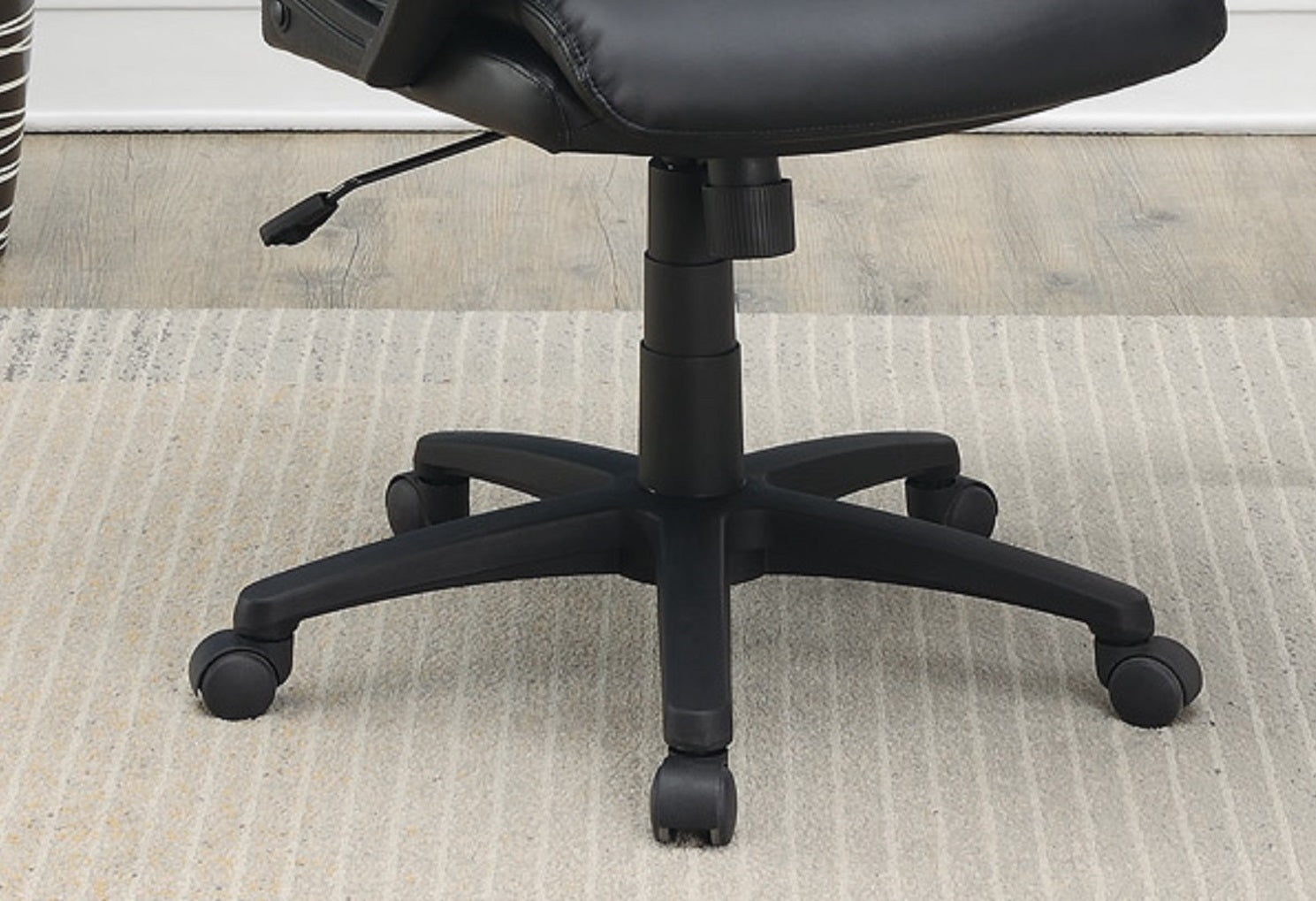 Black ergonomic office chair base with five castor wheels