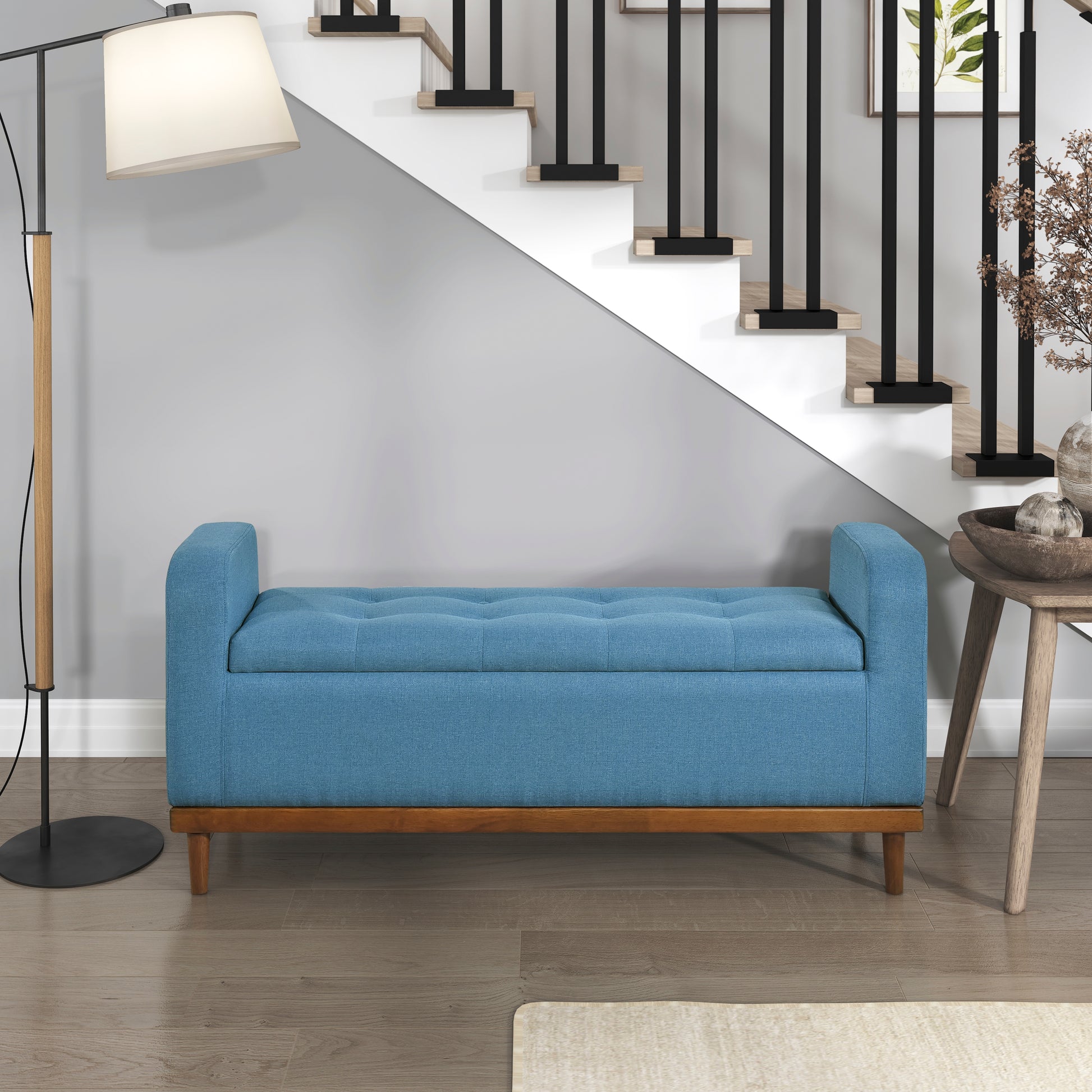 Blue tufted storage bench with wooden legs