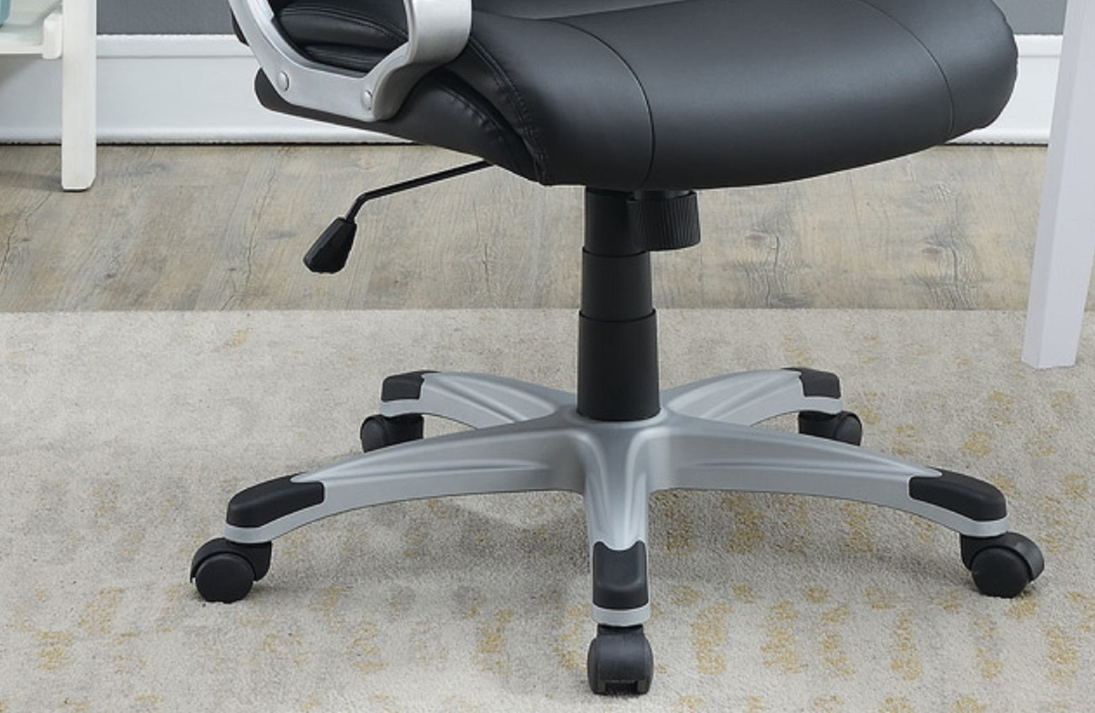 Black executive chair base with silver fivestar legs and smoothrolling casters