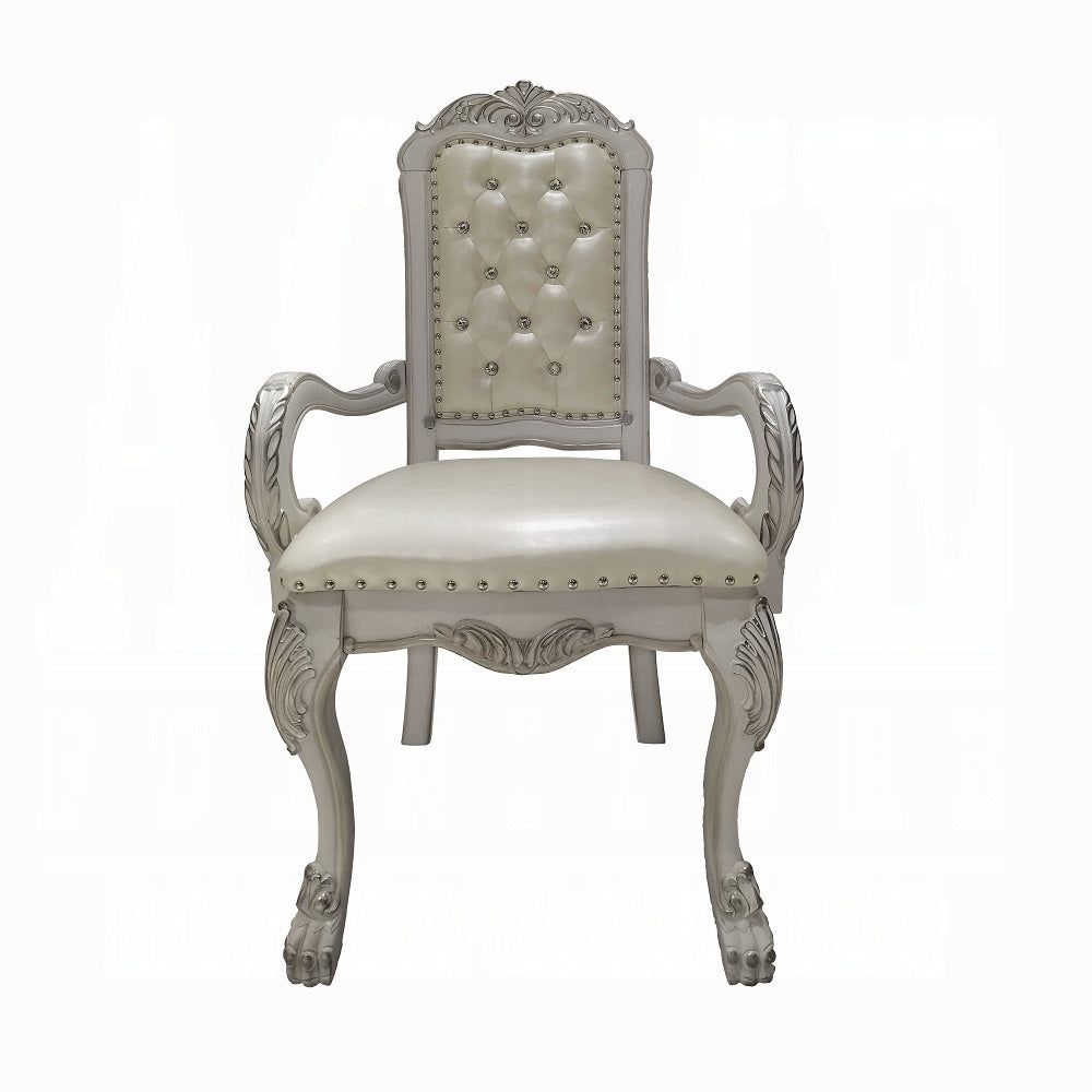 Ornate silver accent chair with tufted white leather seat and back perfect for elegant dining