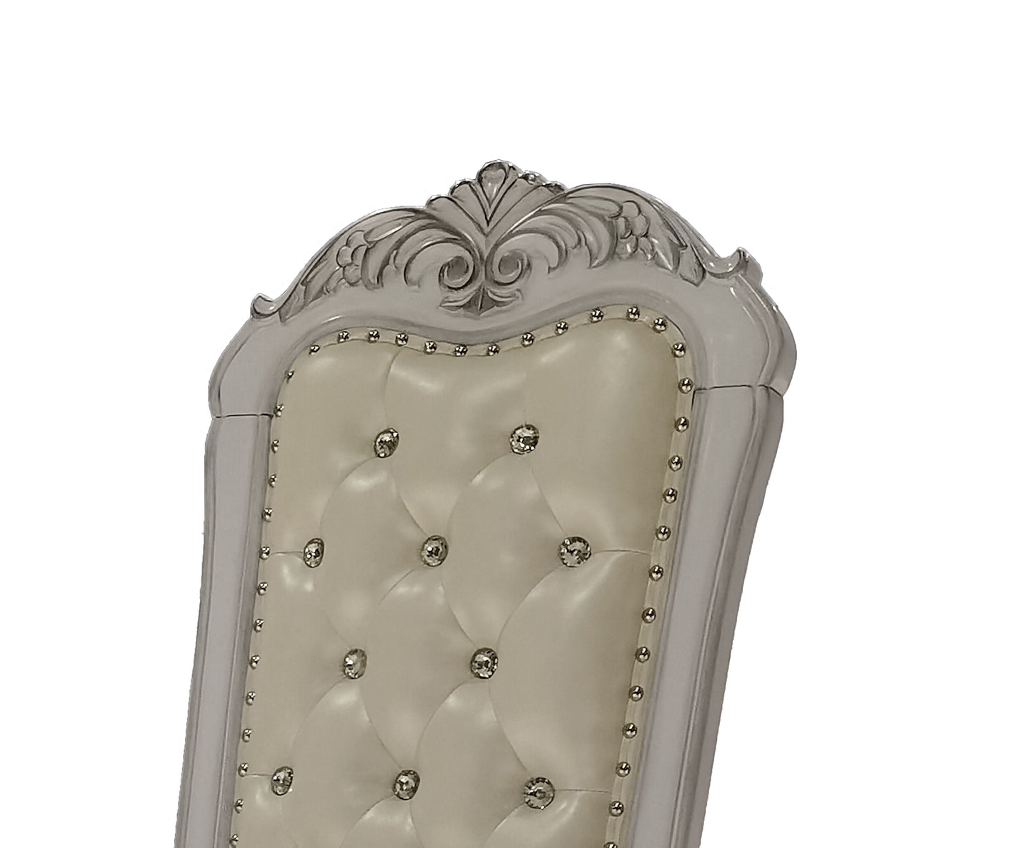 Cream upholstered tufted dining chair with rhinestone accents and carved silver wood trim