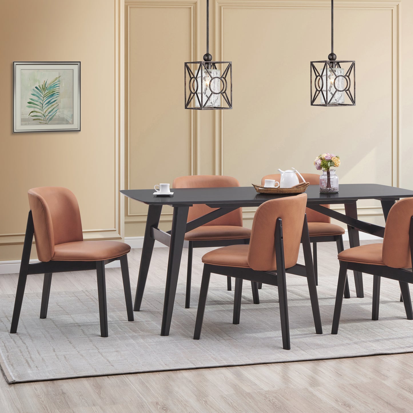 Modern dining chairs with orange faux leather upholstery and black wooden frames