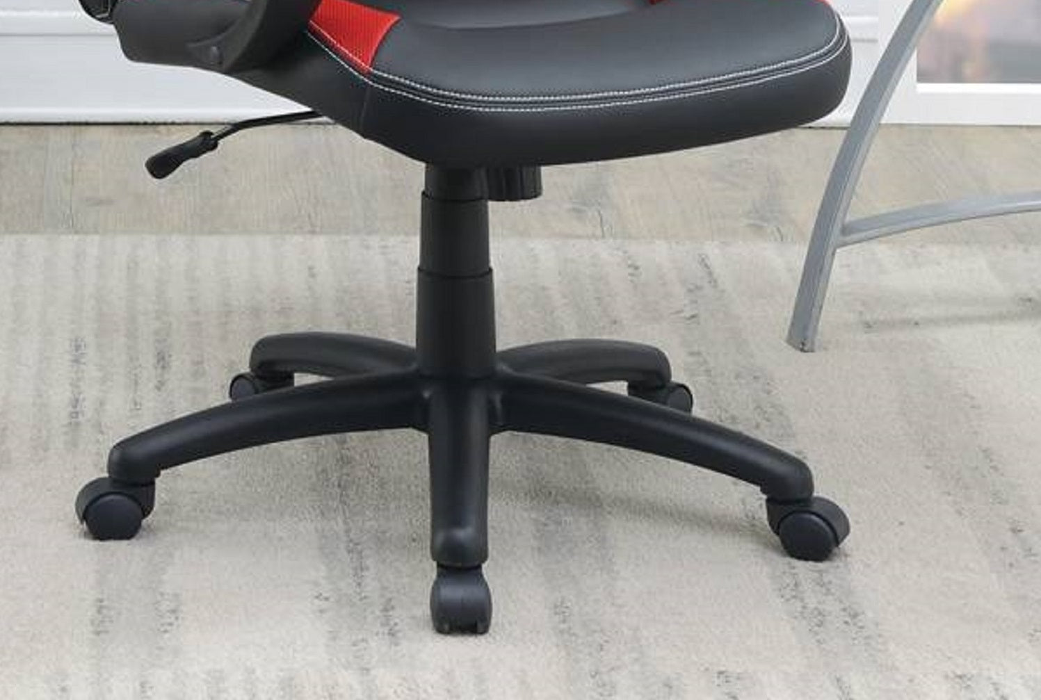 Black ergonomic gaming chair base with five wheels and tilt lever