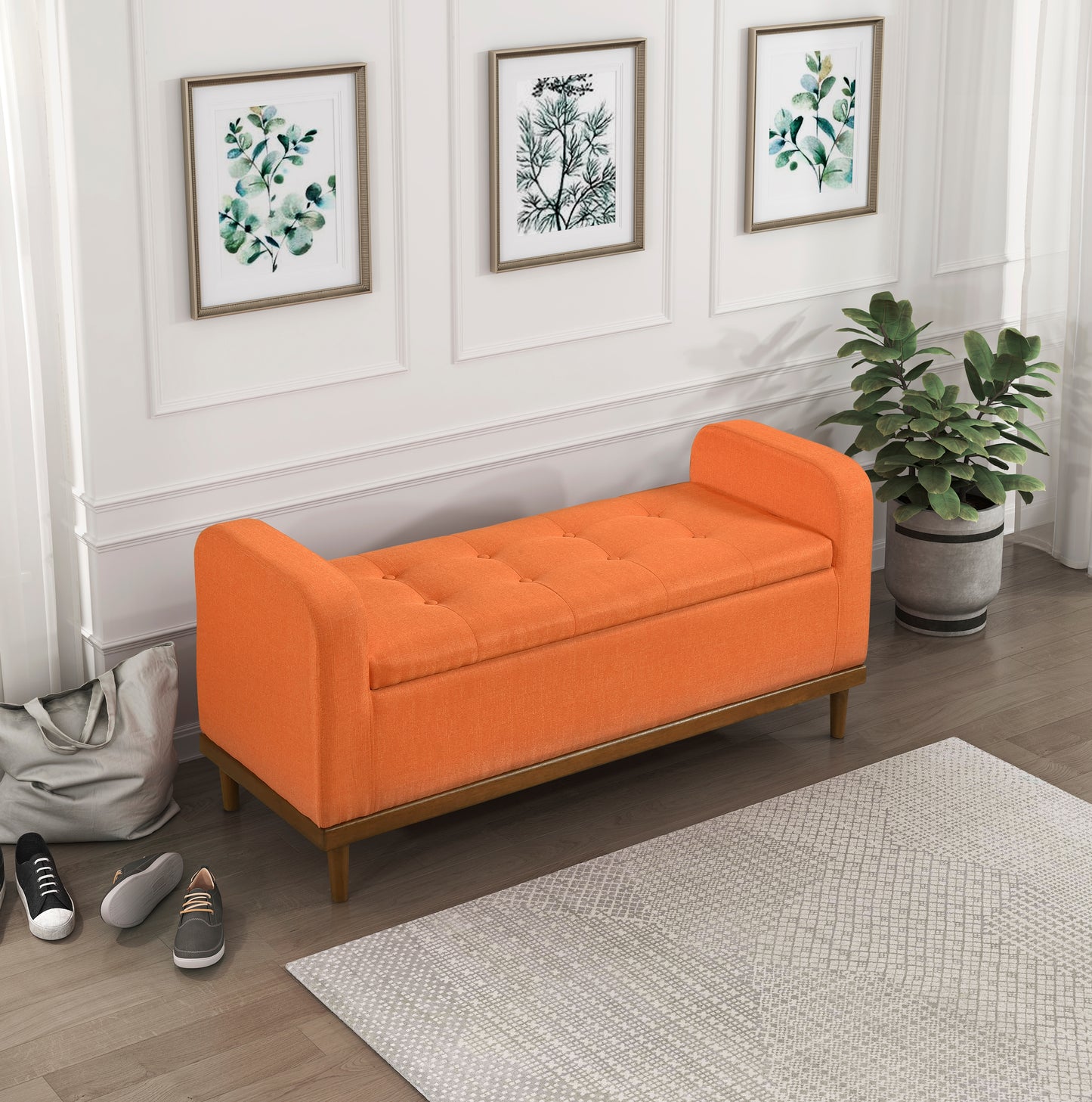 Orange tufted storage bench with wooden legs