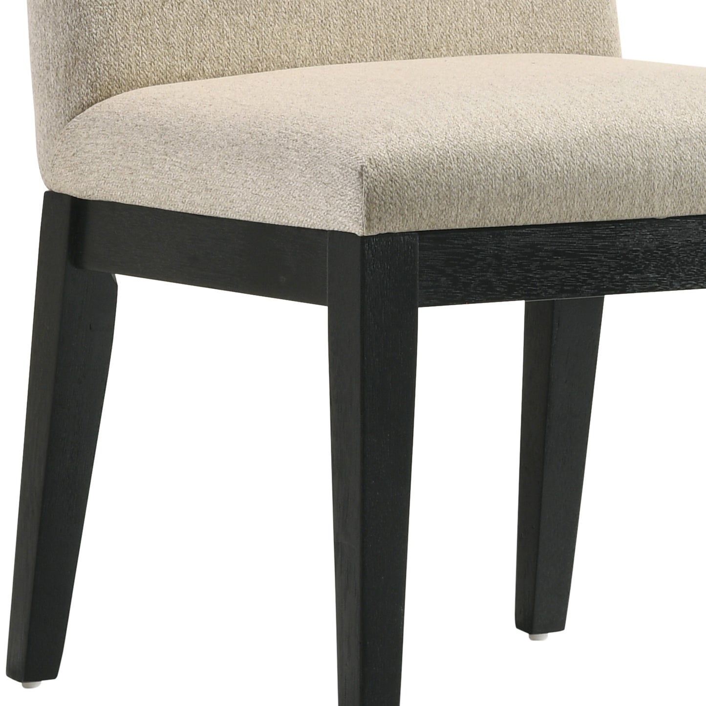 Closeup of a beige upholstered dining chair with dark wood legs
