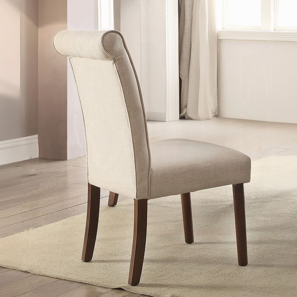 Upholstered dining chair in beige linen fabric with a rolled back and dark wood legs