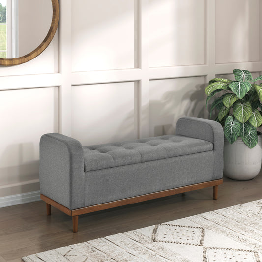 Gray tufted storage bench with wood legs