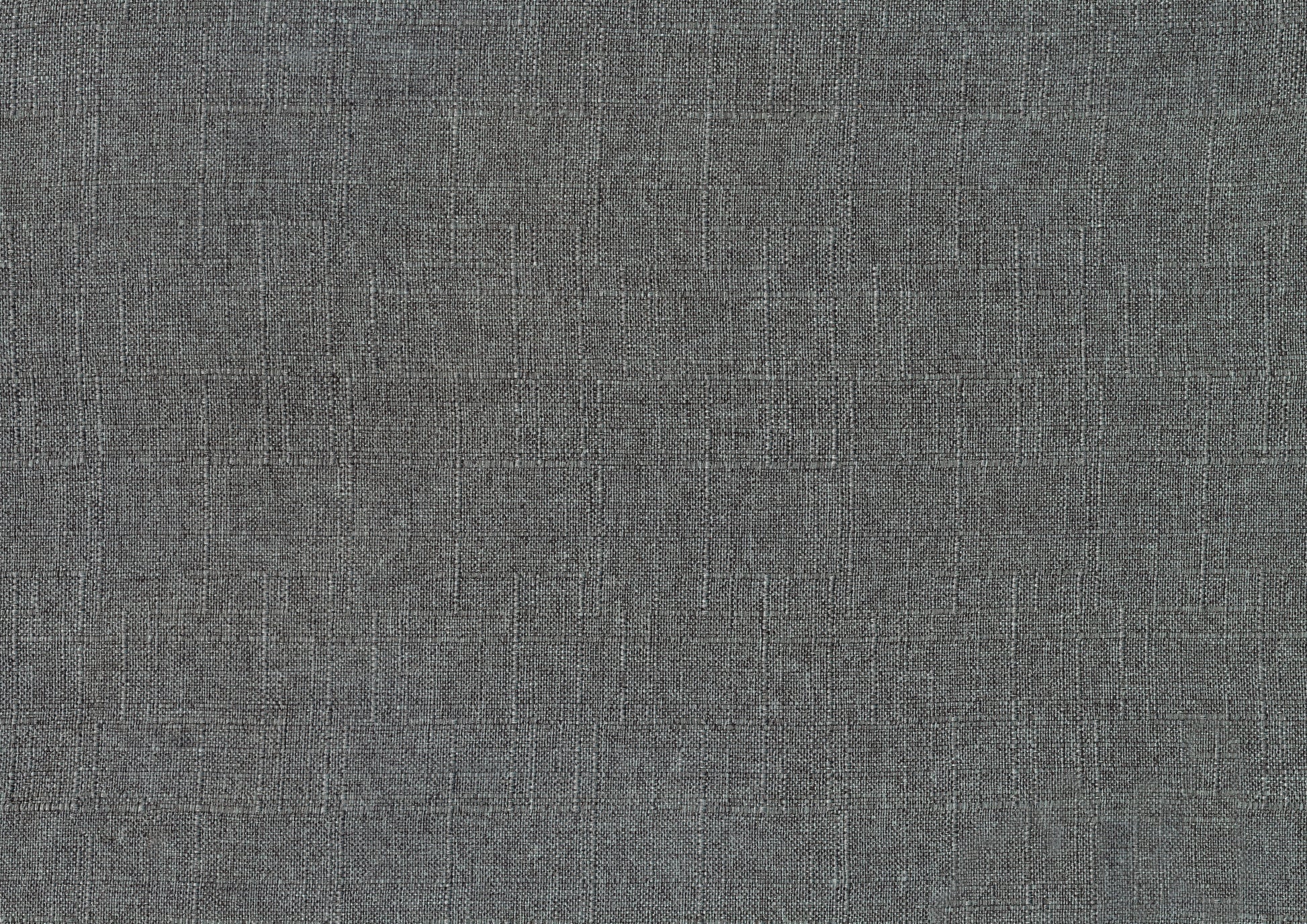 Closeup of a textured dark grey woven fabric swatch for upholstery