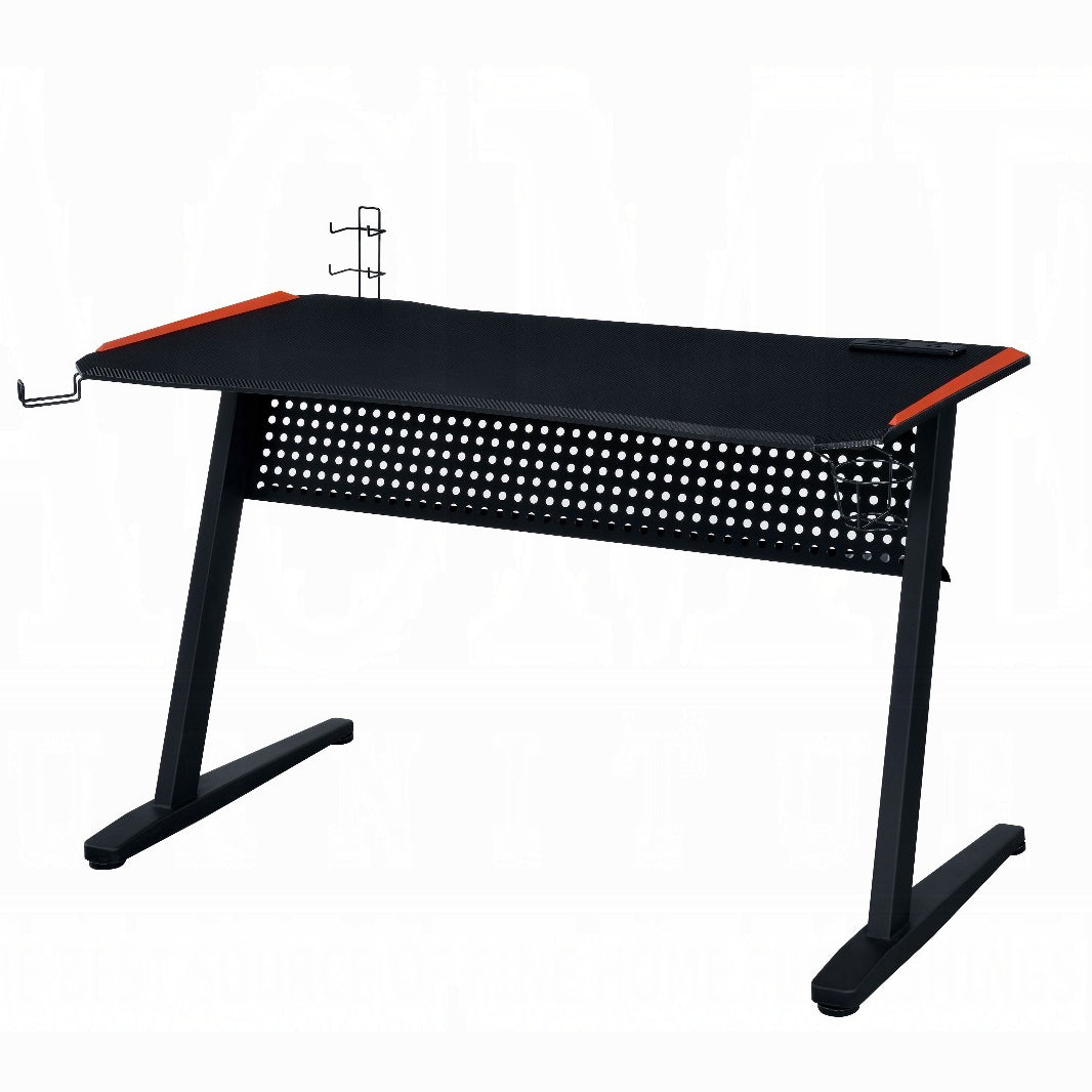 Black gaming desk with perforated front and orange accents ideal for PC setups