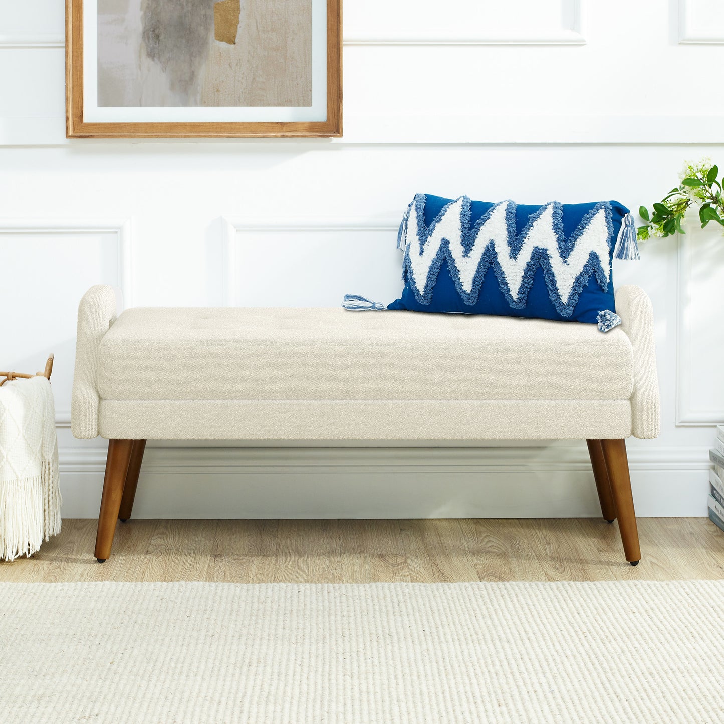 Cream upholstered bench with tufted seat and wooden legs
