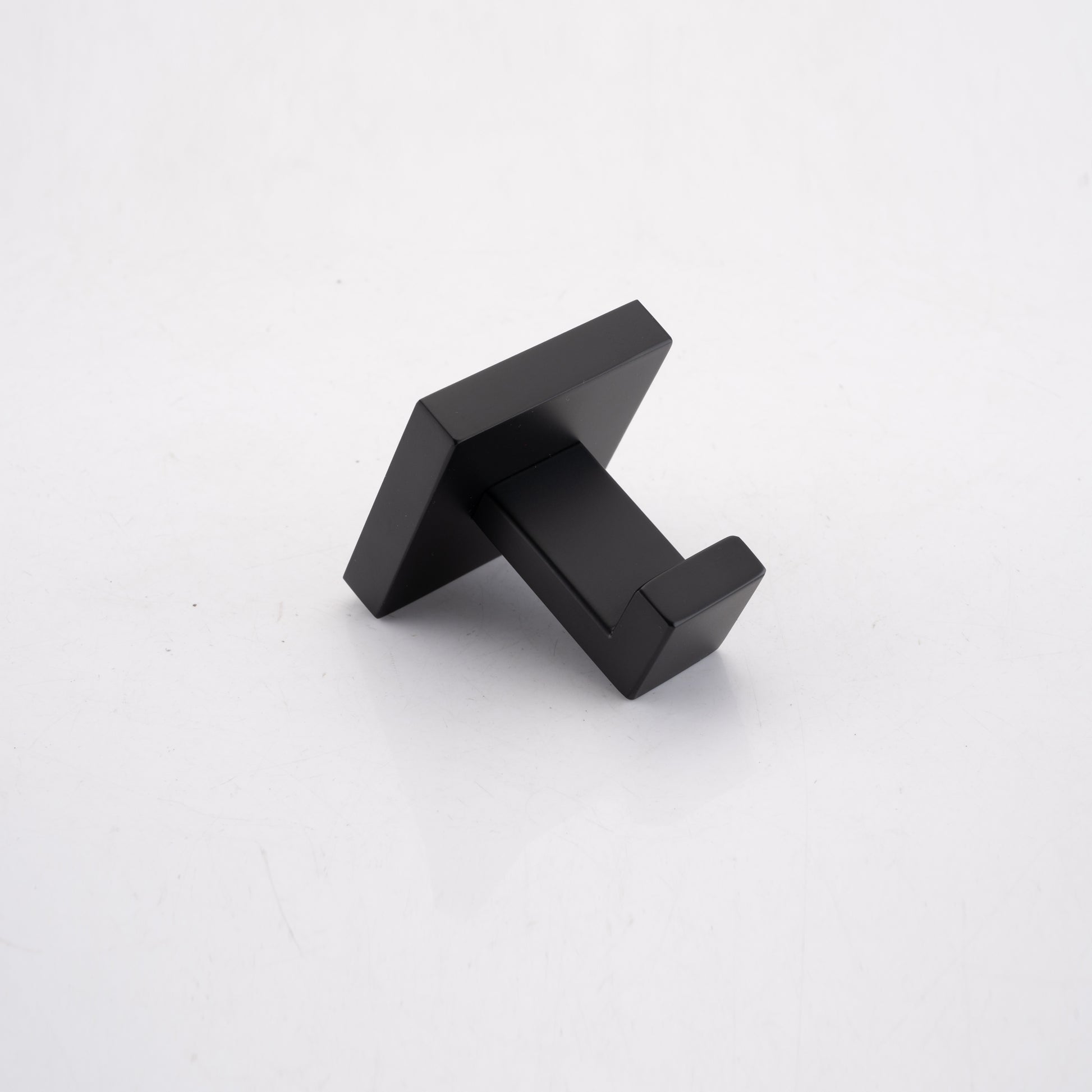 Modern matte black stainless steel wall hook for towels featuring a minimalist square base design