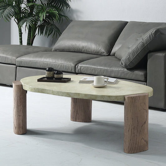Oval concrete coffee table with textured wood legs modern living room centerpiece