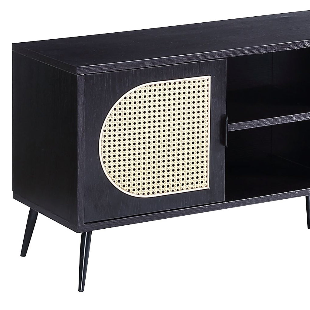 Black wooden tv stand with rattan cane door insert and tapered legs