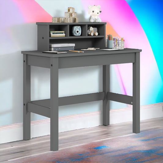 Gray wooden kids desk with hutch and desk organizer filled with art supplies