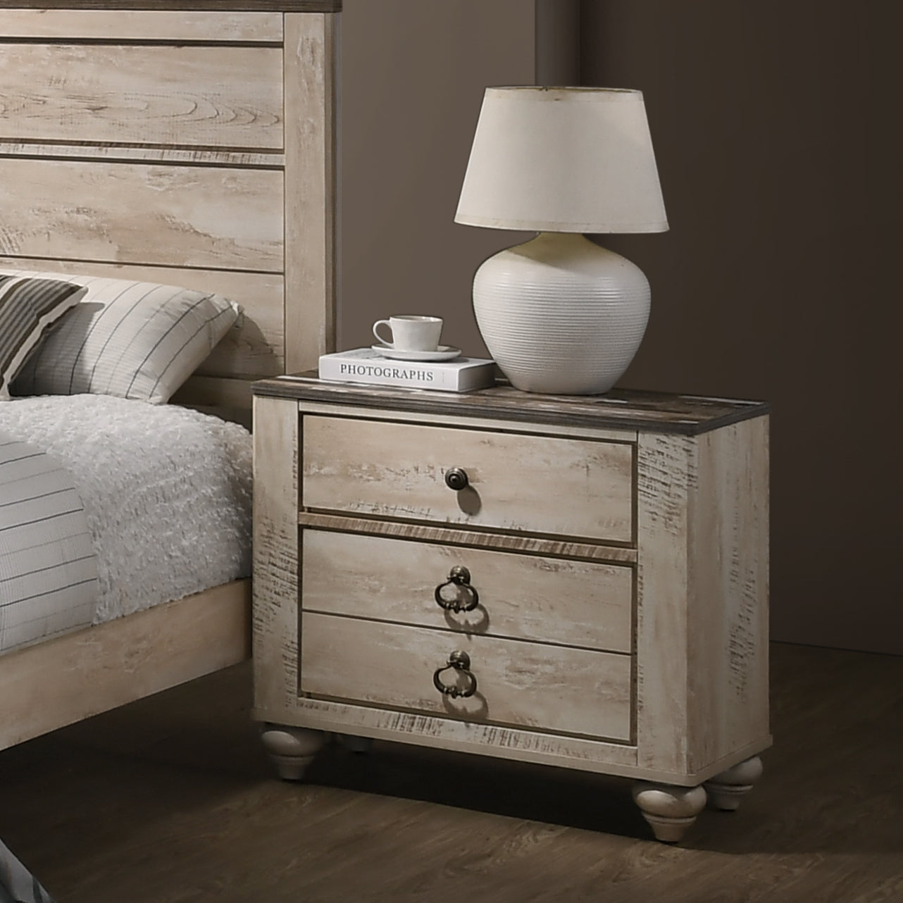Farmhouse style nightstand with distressed white finish and three drawers