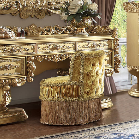 Tufted velvet vanity stool in gold with fringe detail perfect for a luxurious dressing area