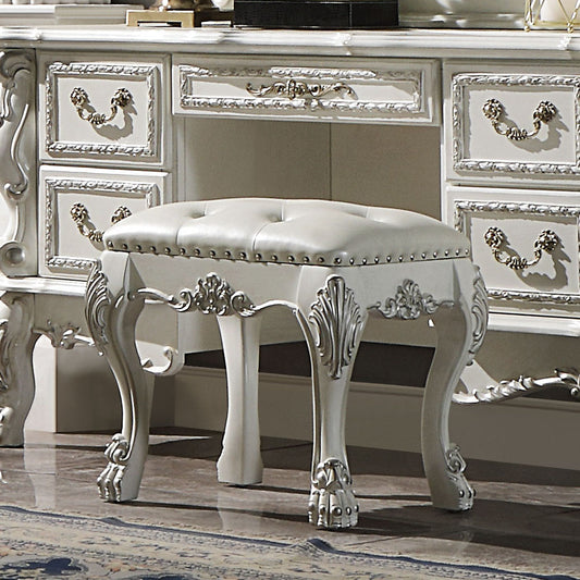 Tufted ivory upholstered vanity stool with ornate carved white legs