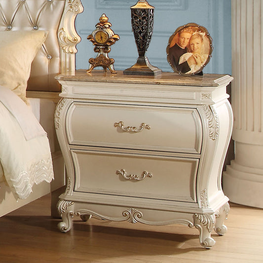 Ornate cream twodrawer nightstand with gold hardware and marble top ideal for bedroom decor