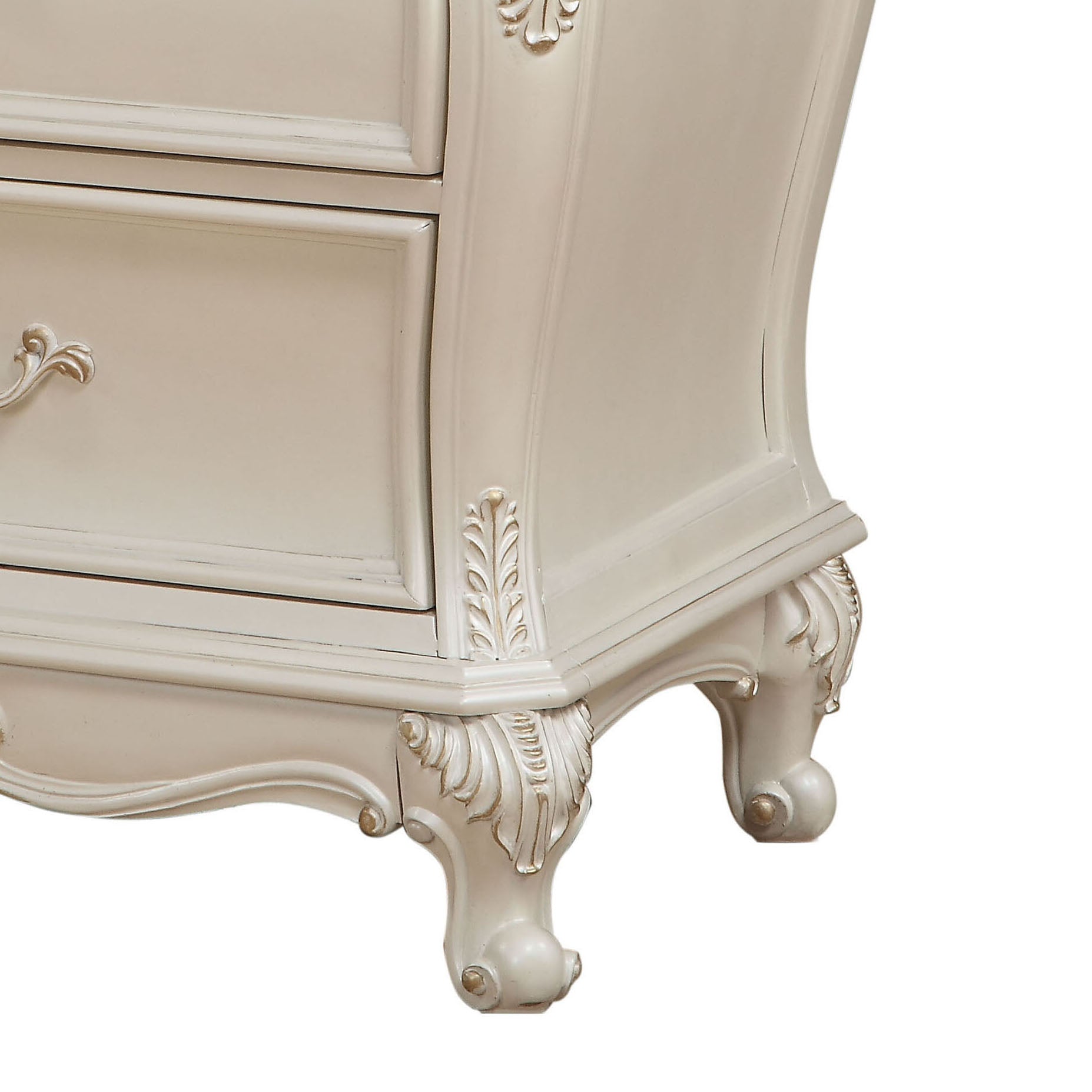 Cream ornate dresser legs with carved detailing and gold accents part of French country furniture
