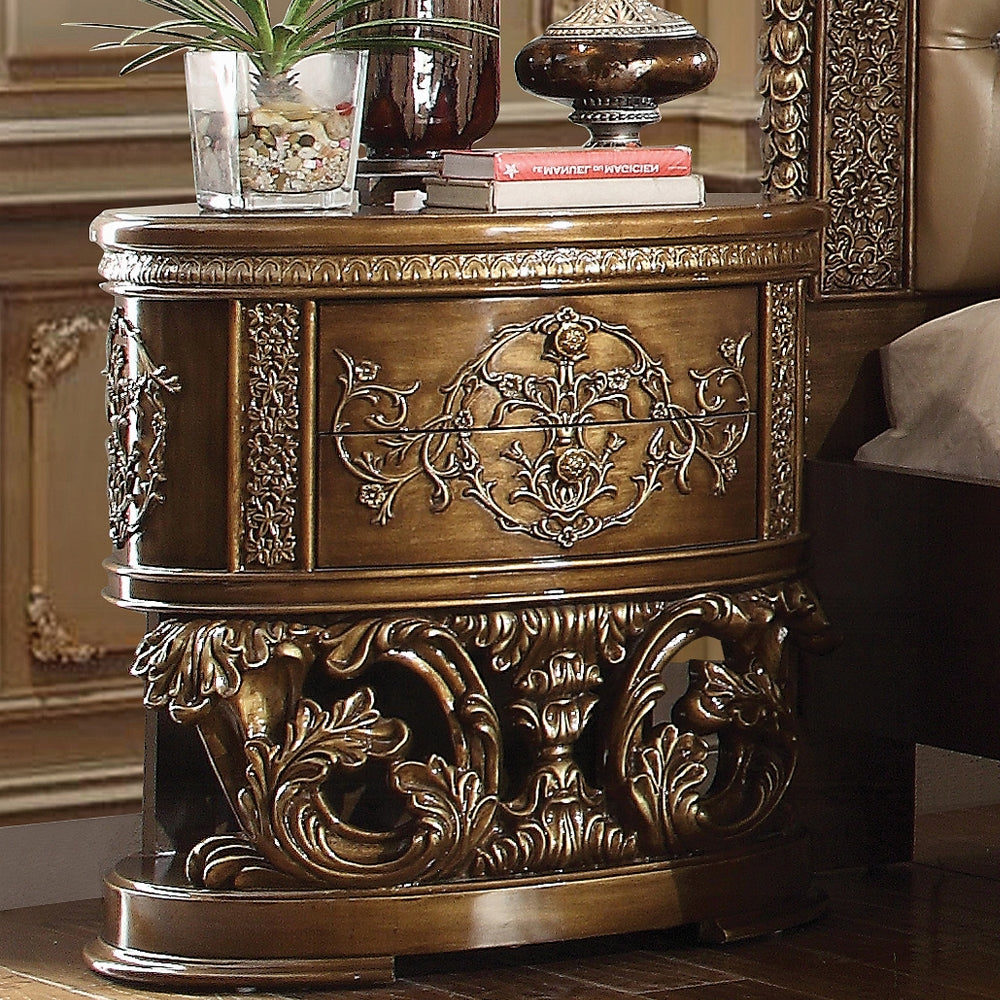 Antique gold ornate nightstand with carved floral details