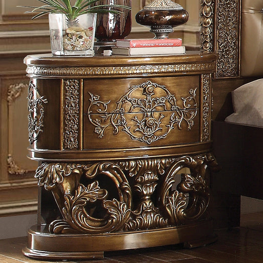 Antique gold ornate nightstand with carved floral details