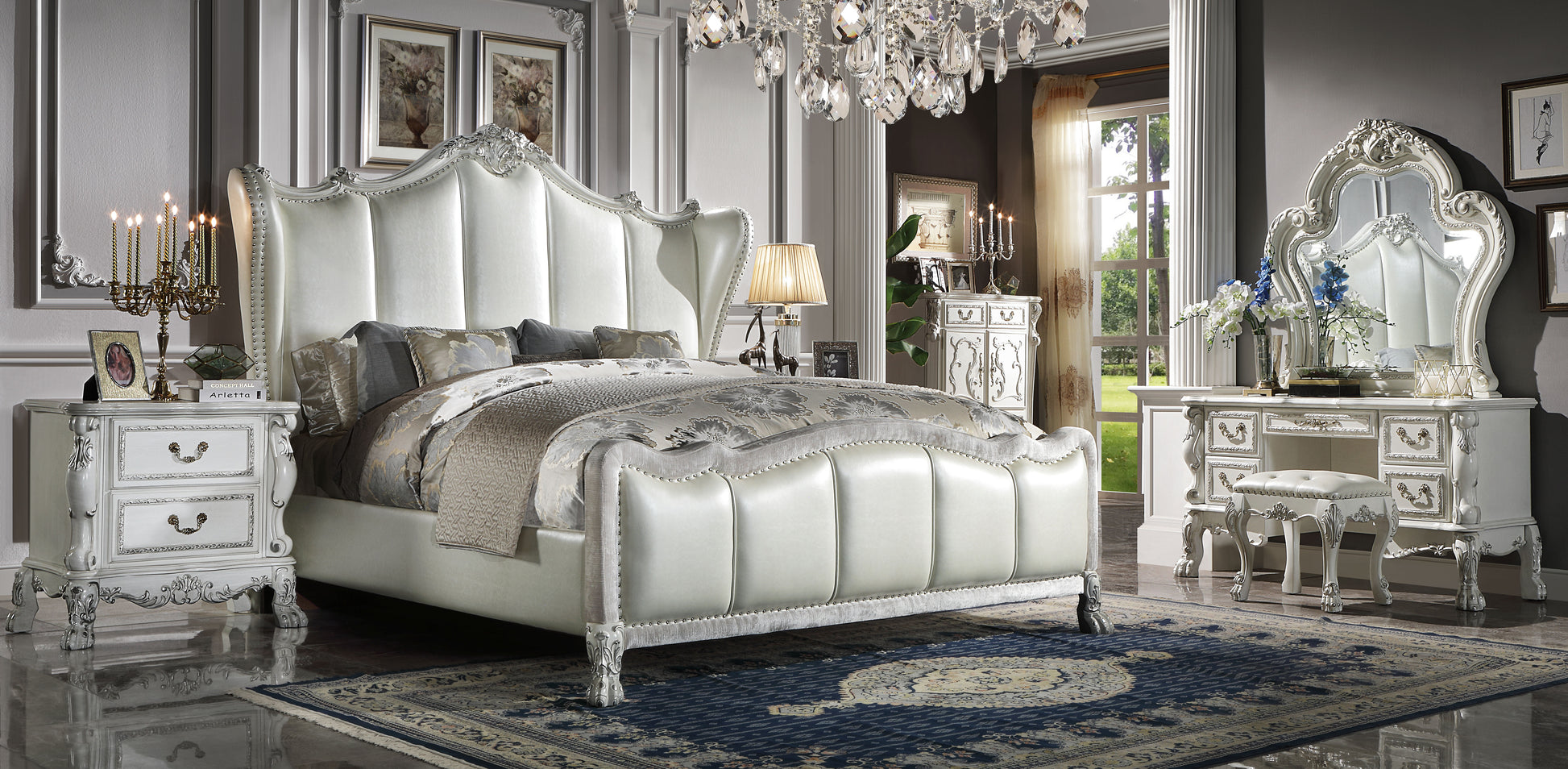 Ornate white upholstered king bed with crystal chandelier a luxurious bedroom centerpiece
