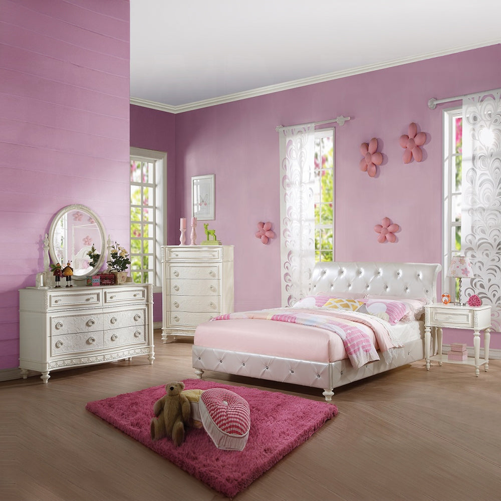 White tufted upholstered twin bed with pink bedding for a girls bedroom
