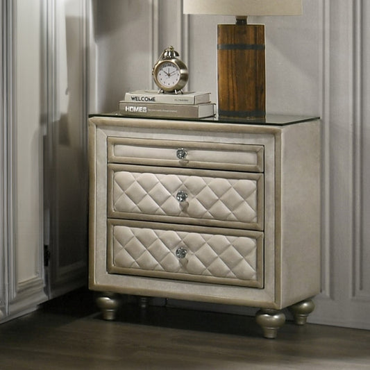 Elegant cream upholstered nightstand with diamond tufting and crystal knobs