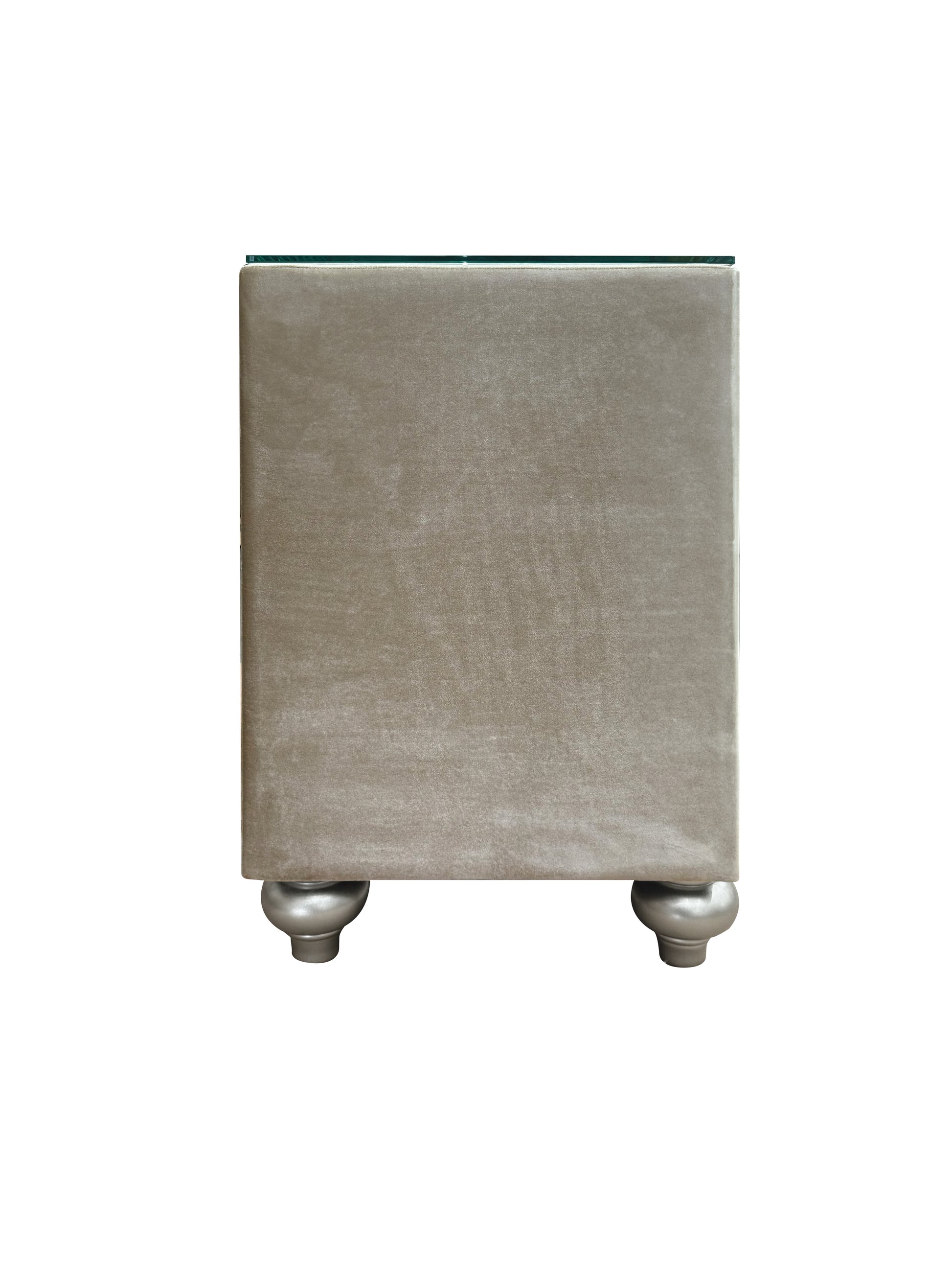 Taupe velvet bedside table with glass top and silver bun feet