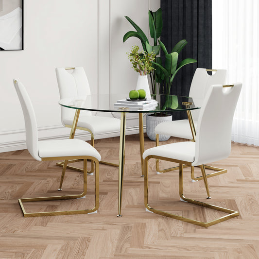 Round glass dining table with four white chairs and gold legs perfect for modern homes