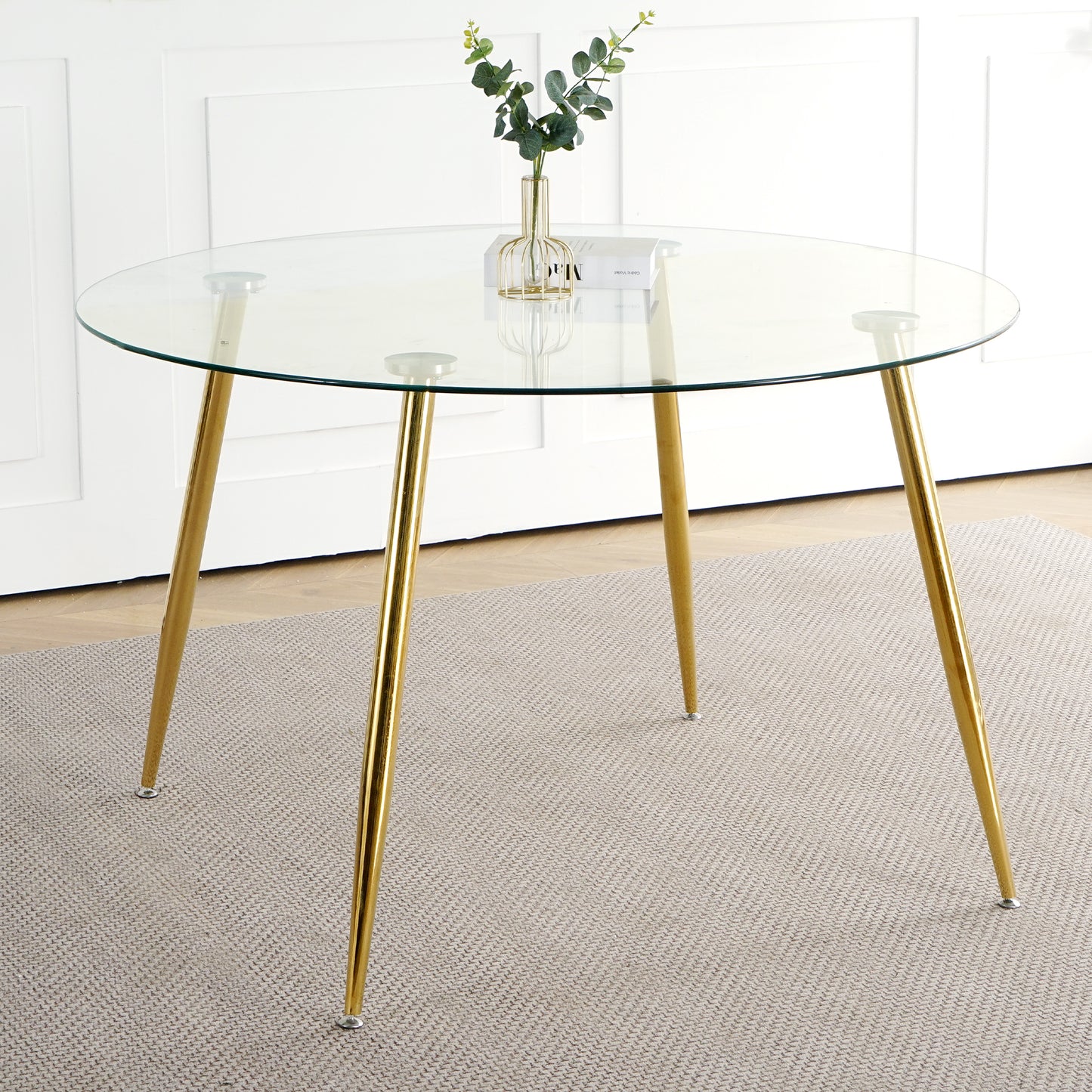 Round glass dining table with gold hairpin legs modern accent piece