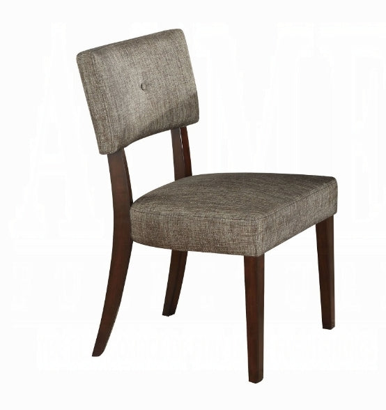Textured grey upholstered dining chair with dark wood legs and a button tufted back