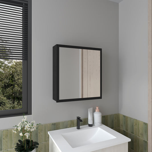 Modern black framed medicine cabinet with mirrored doors above a white sink and black faucet