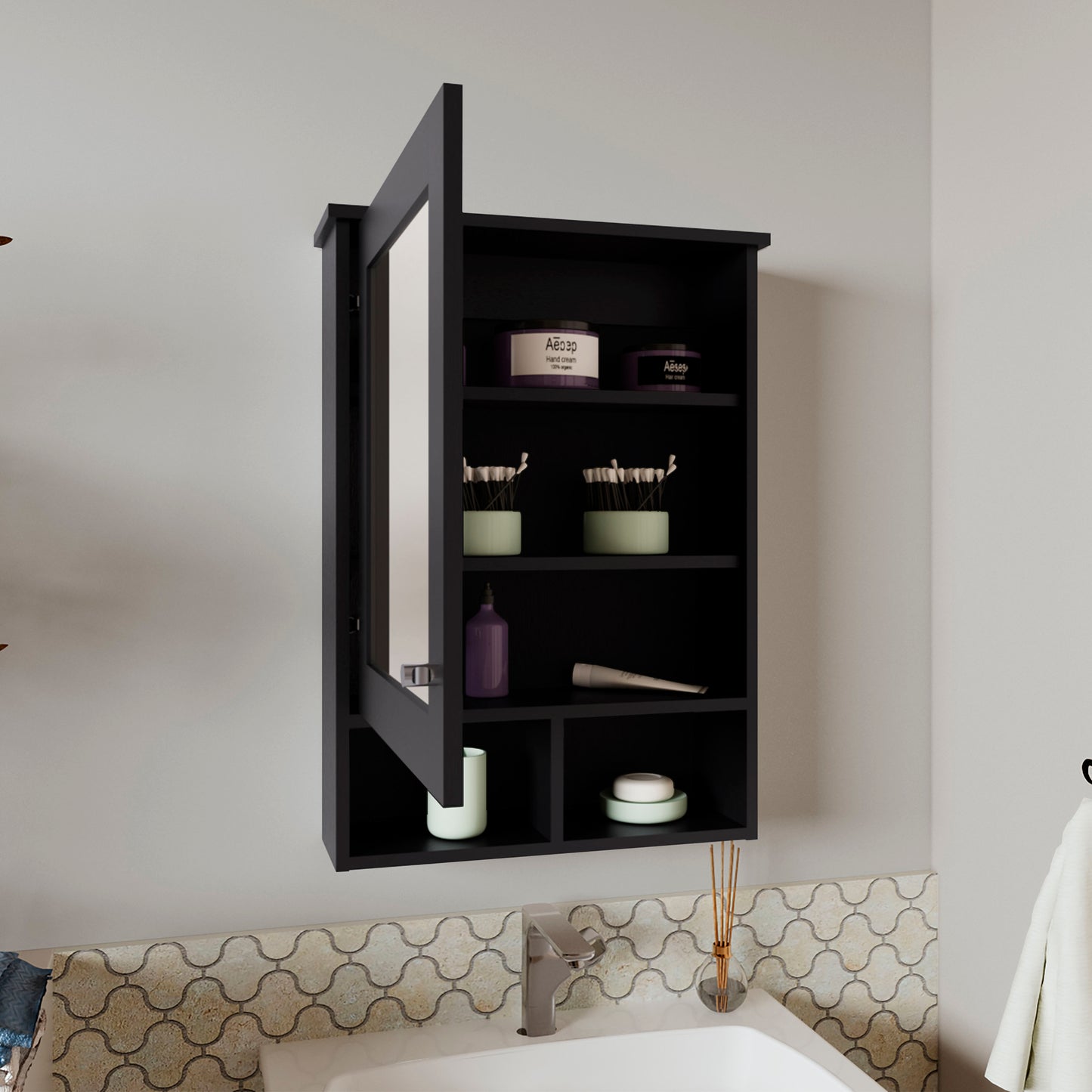 Black mirrored medicine cabinet with open door storing toiletries