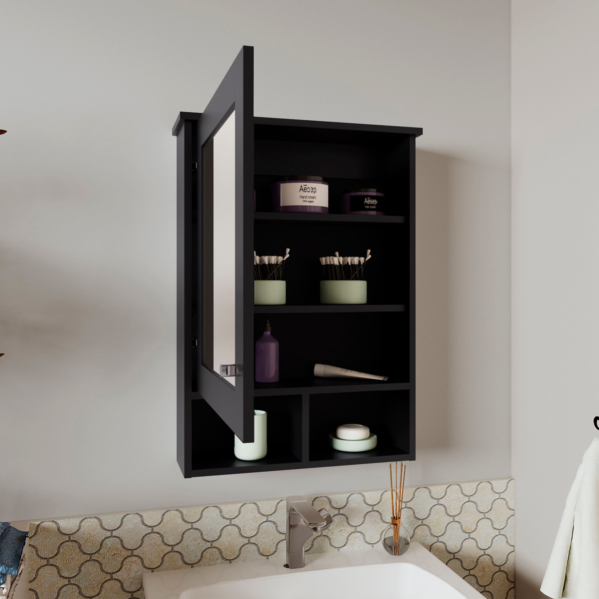Black mirrored medicine cabinet with open door storing toiletries