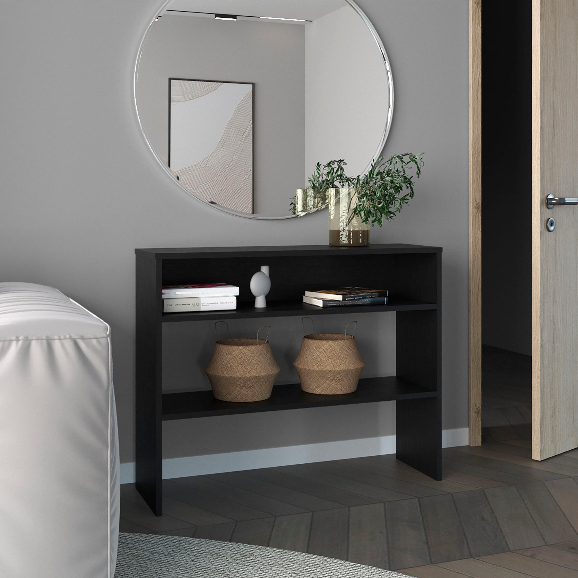 Black twoshelf console table with decorative baskets and books for entryway storage