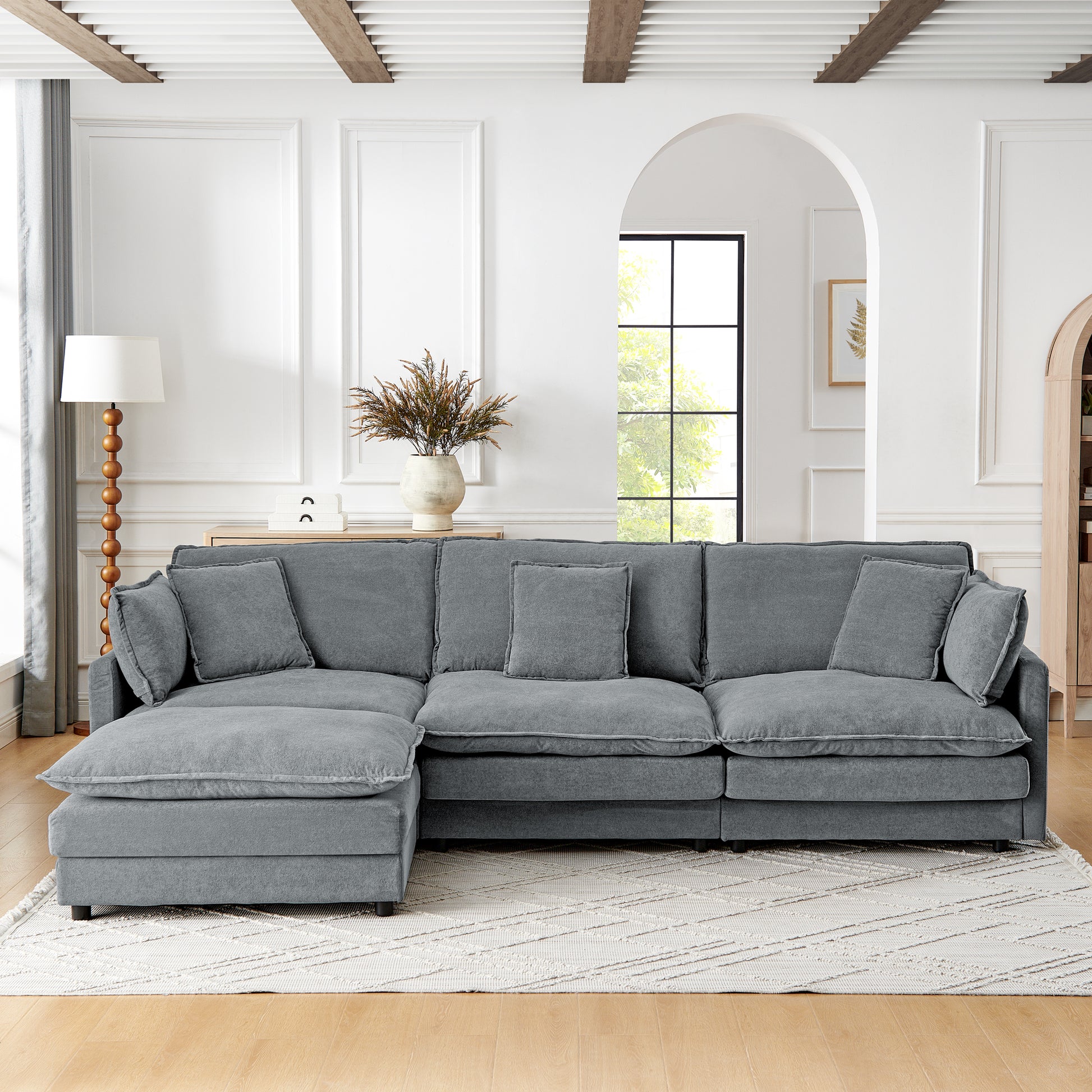 Deep grey sectional sofa with plush cushions and textured fabric perfect for modern living rooms