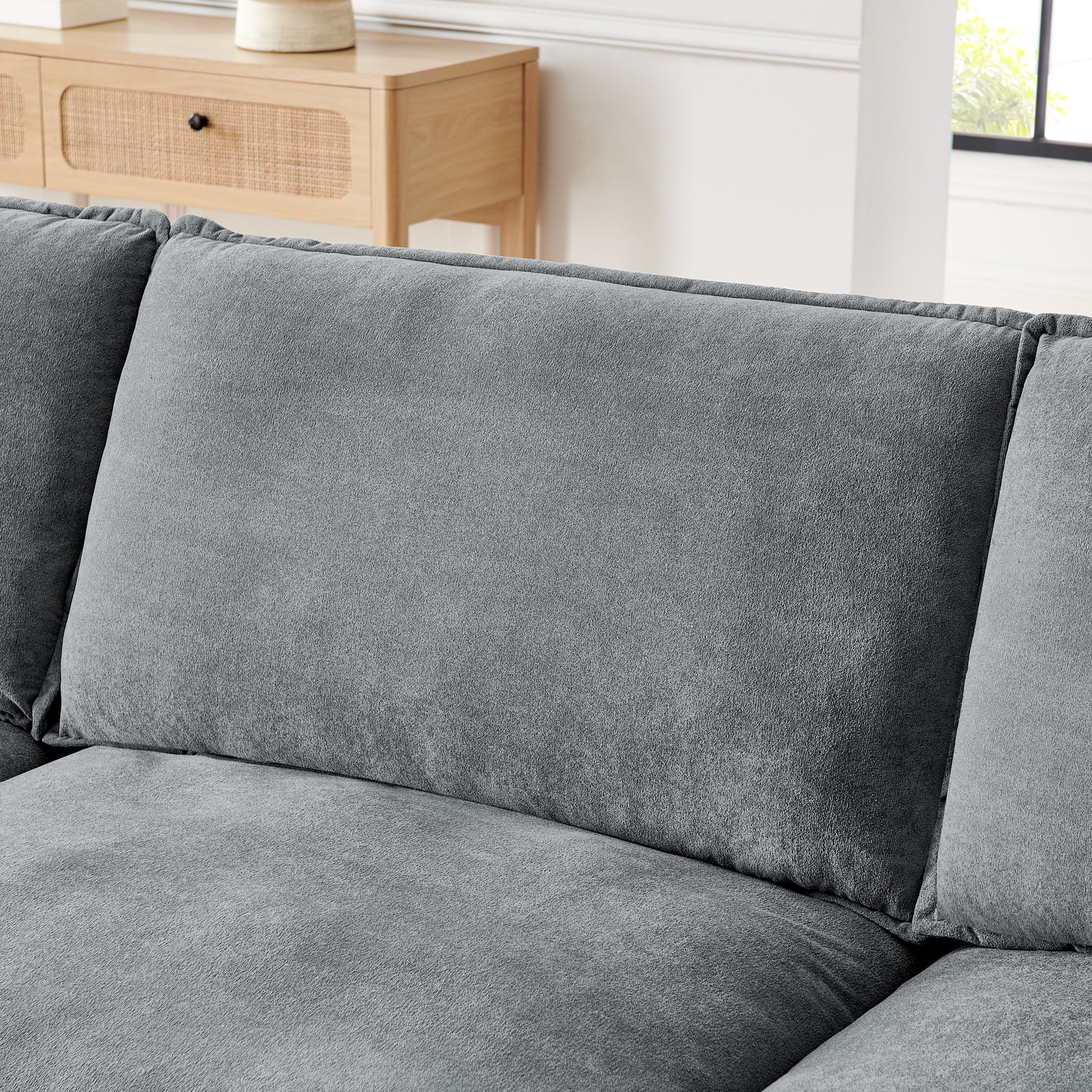 Plush grey fabric sectional sofa with deep comfortable cushions for modern living rooms